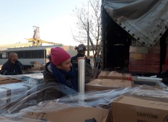 Volunteers in Poland work hard to unload and sort donations