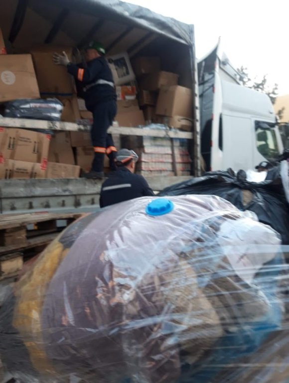 Lorry  of donations being unpacked and sorted in Poland