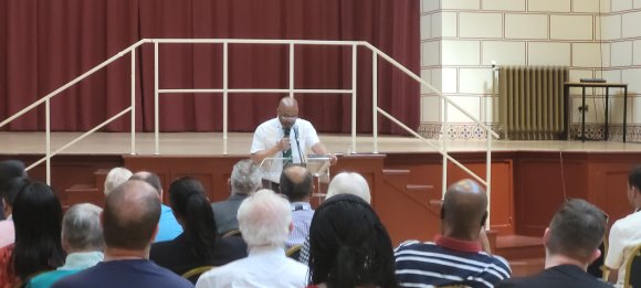 Martin Cole of Northampton Windrush Generation and Descendant UK addresses attendees for Windrush Day 22